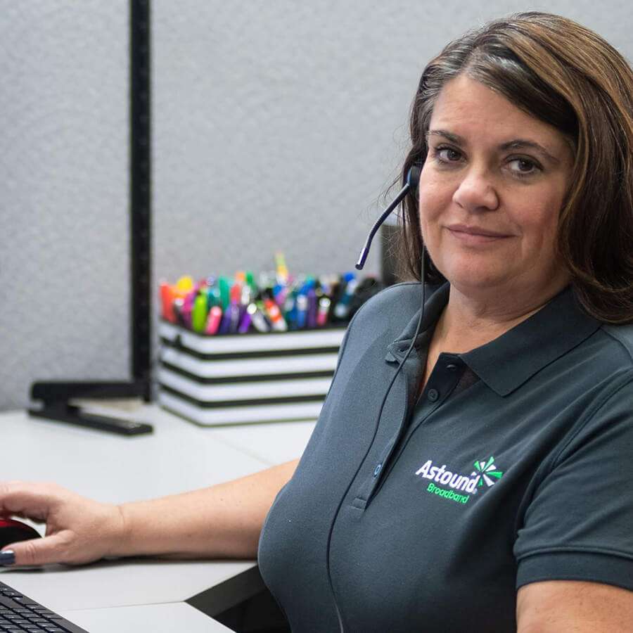 astound employee working at her desk