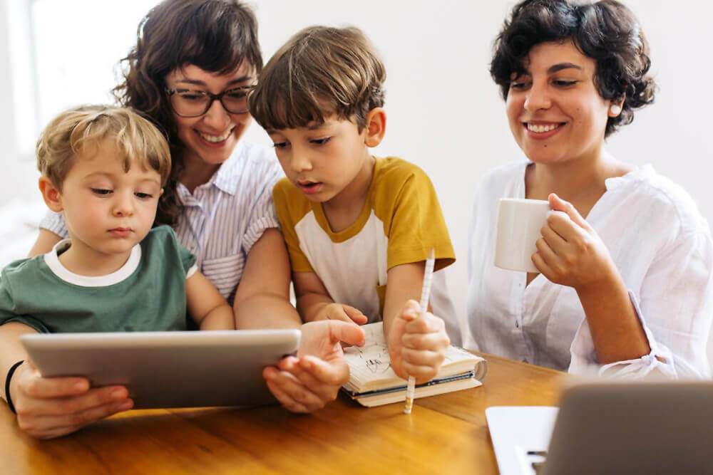 two moms teaching kids about Pride Month