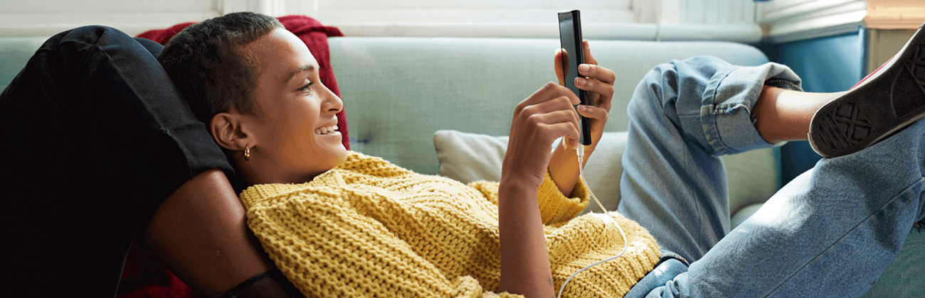 Woman reclines with phone