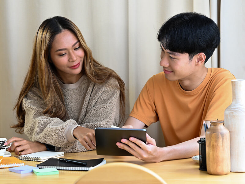 couple looking at a tablet