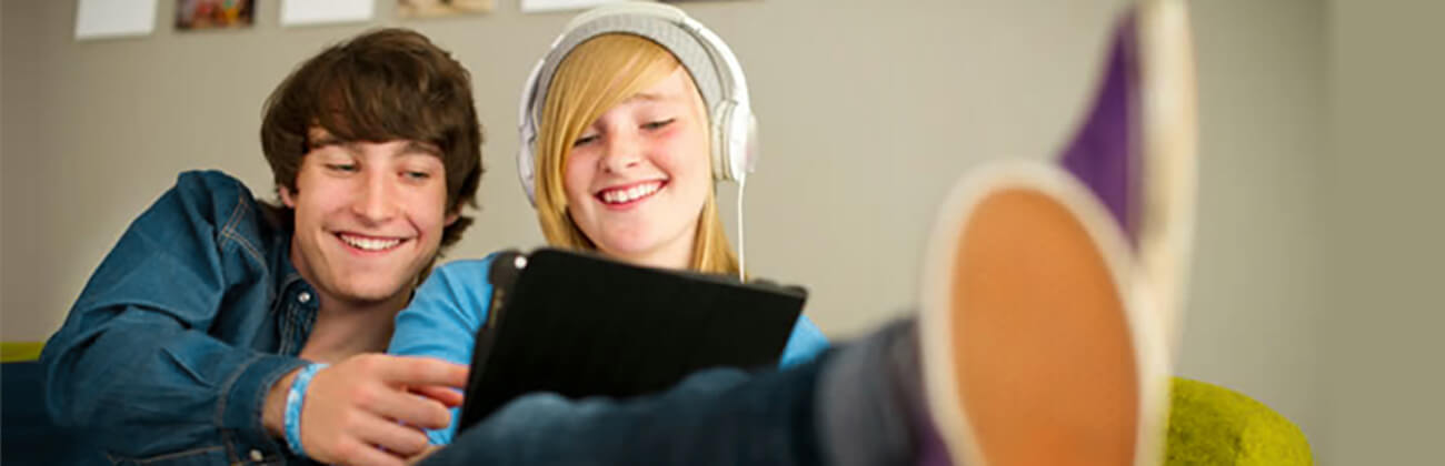 two teens with tablet