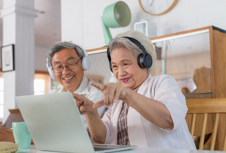 senior couple keeps in touch with family online